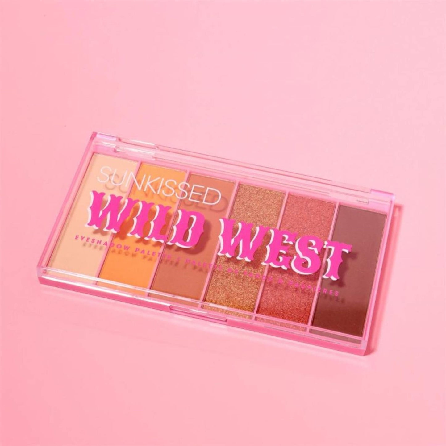 Sunkissed Wild West eyeshadow palette angled view with clear lid and hot pink western typography