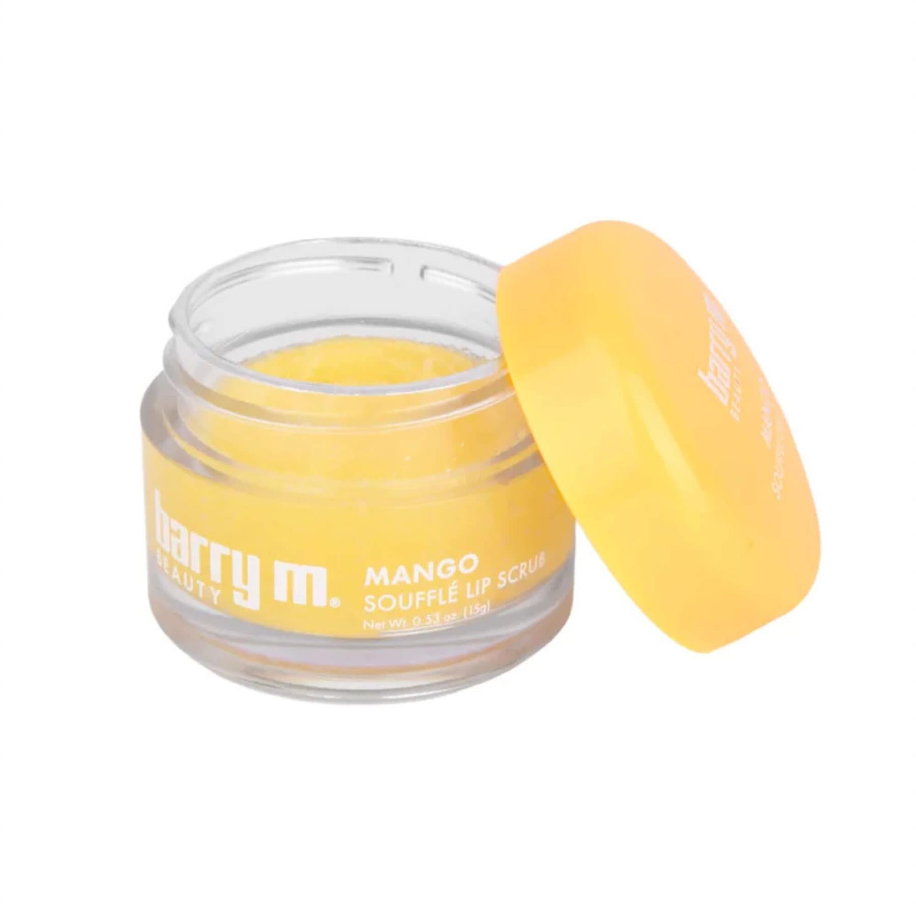 Barry M Mango Soufflé Lip Scrub 15g in a clear glass jar with a bright yellow lid showing the grainy yellow sugar scrub texture