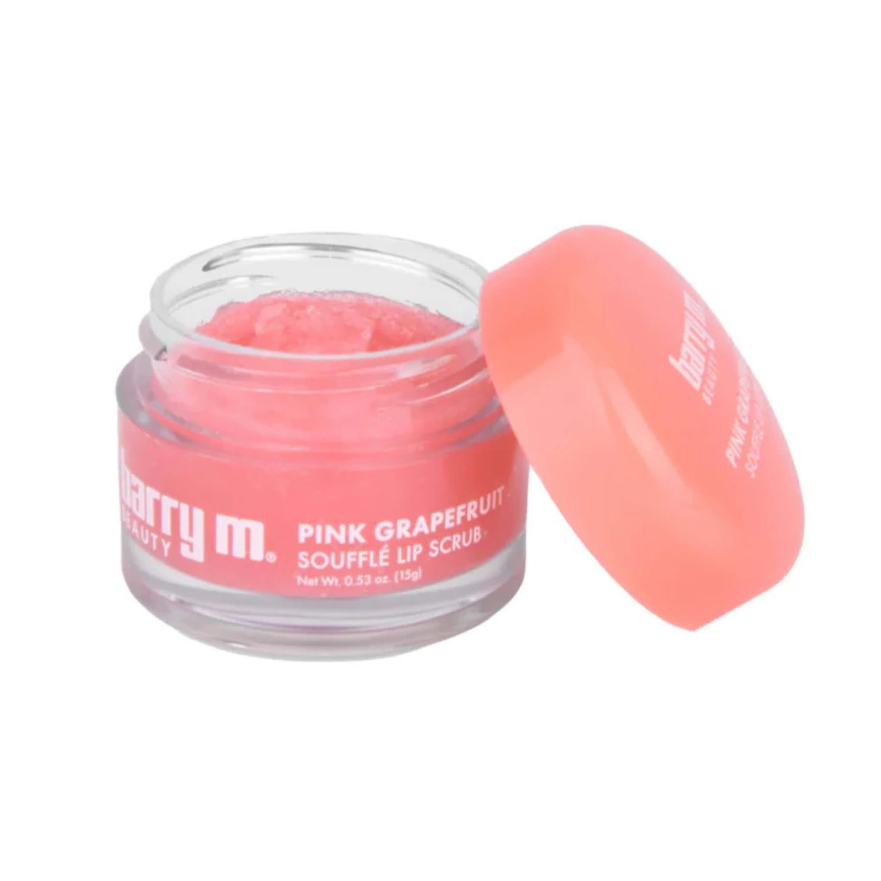 Barry M Pink Grapefruit Soufflé Lip Scrub 15g in a clear glass jar with a coral pink lid showing the grainy sugar scrub texture