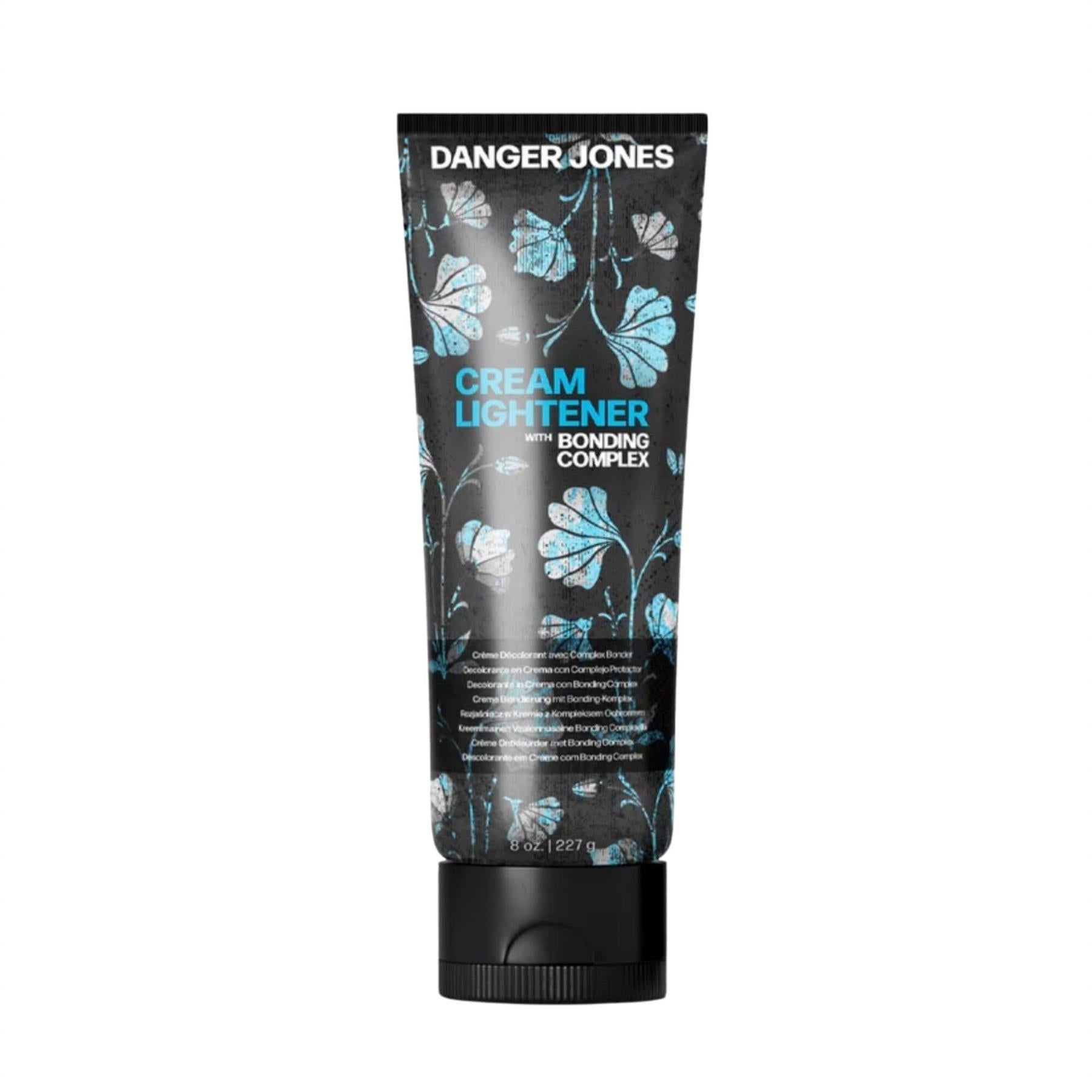 Danger Jones Cream Lightener 227g tube with Bonding Complex featuring artistic blue floral design on matte black packaging