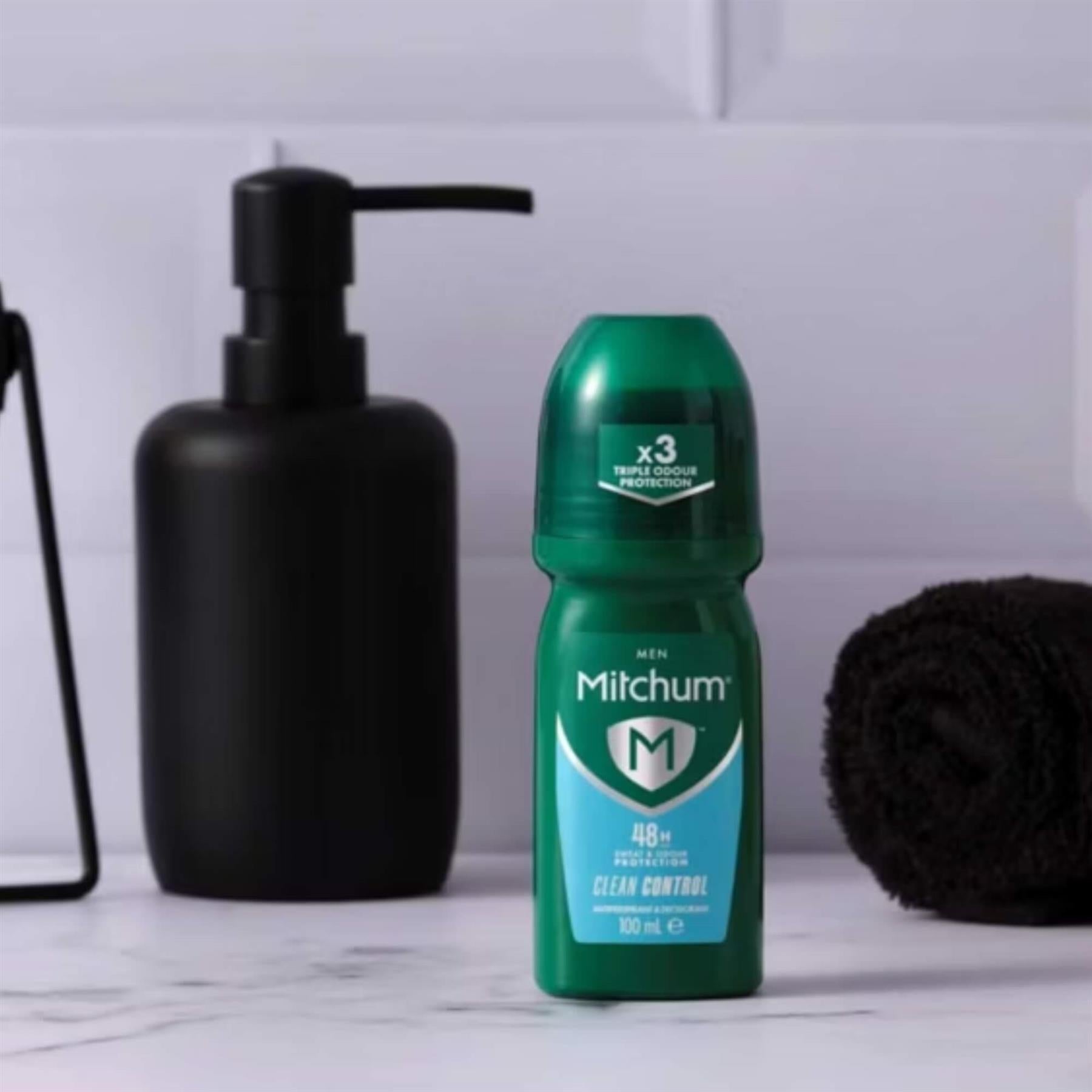 Mitchum Men Clean Control 48H antiperspirant roll-on in modern bathroom setting