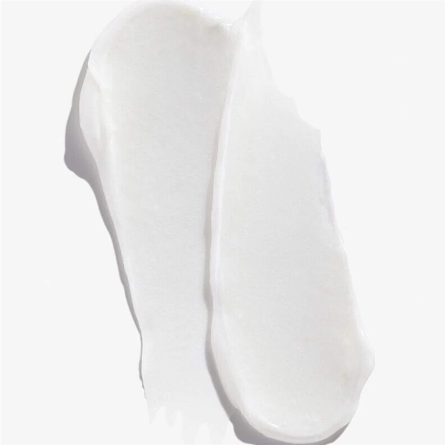 Texture swatch of Redken Acidic Bonding Concentrate Conditioner showing a thick and creamy white consistency