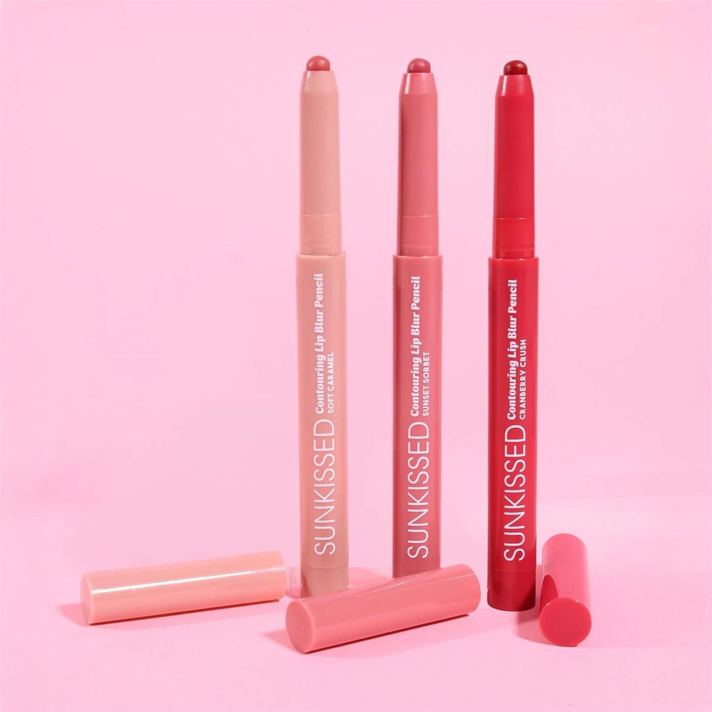 Sunkissed Contouring Lip Blur Pencil shade collection showing Soft Caramel Sunset Sorbet and Cranberry Crush