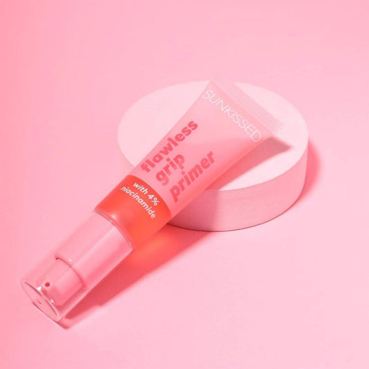 Sunkissed Flawless Grip Primer tube editorial styling on pink podium featuring 4% niacinamide