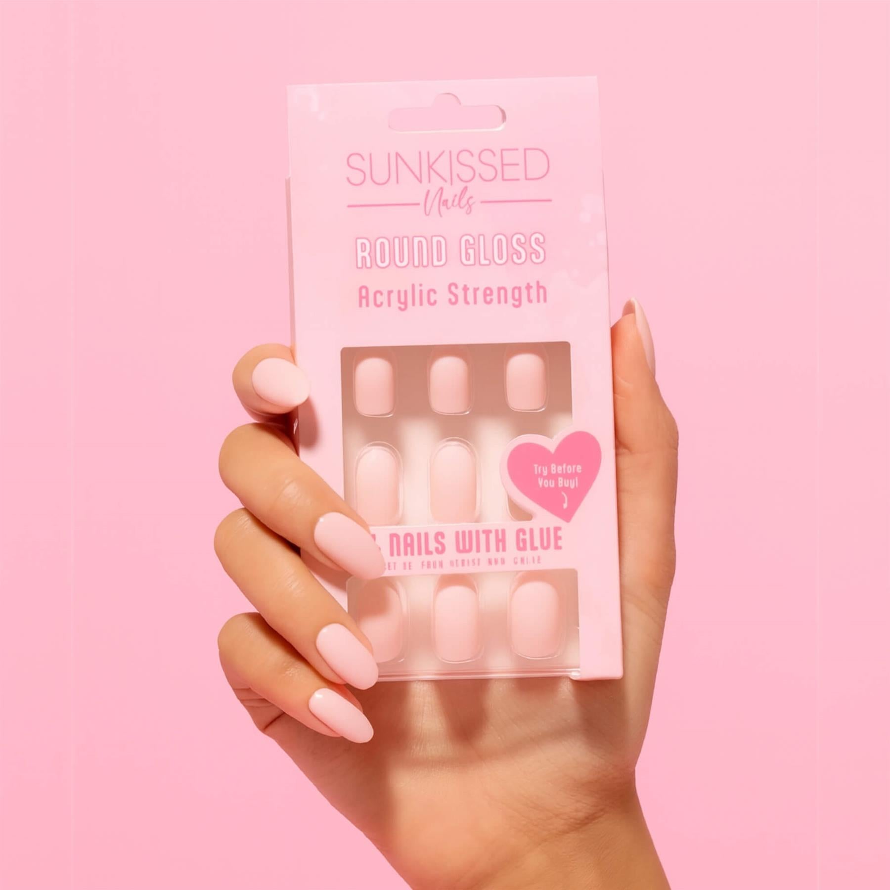 Model wearing Sunkissed Round Gloss pink acrylic strength false nails for salon finish