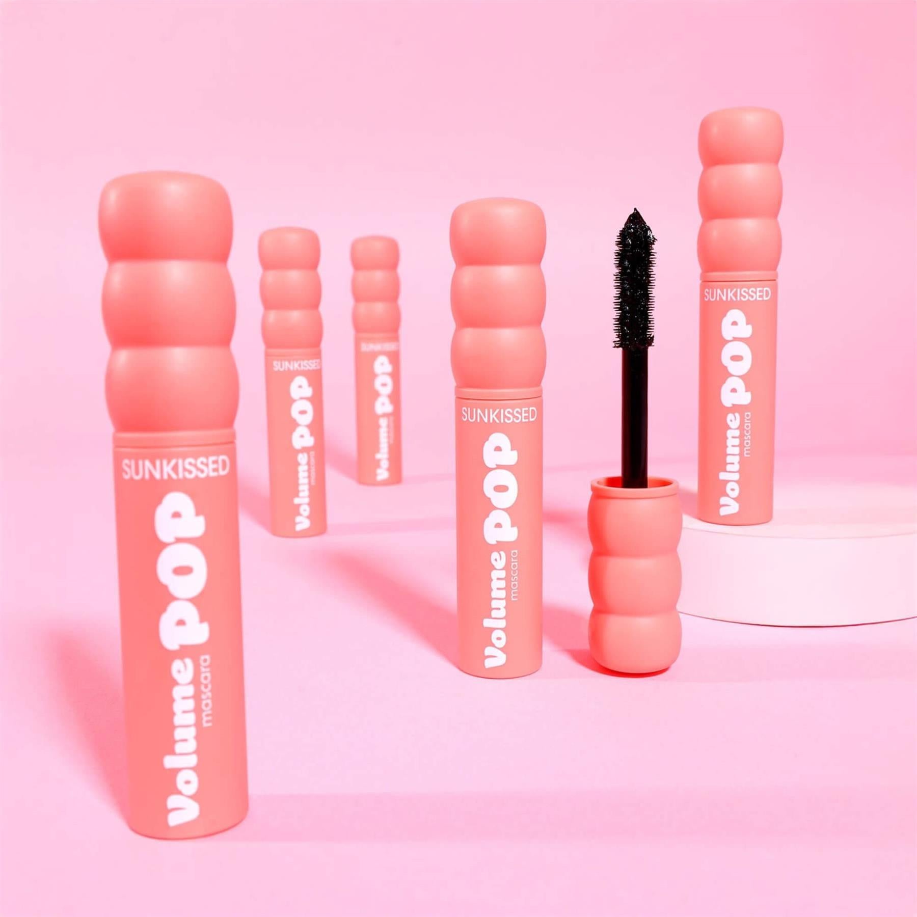 Group arrangement of Sunkissed Volume Pop Mascaras in pink bubble packaging