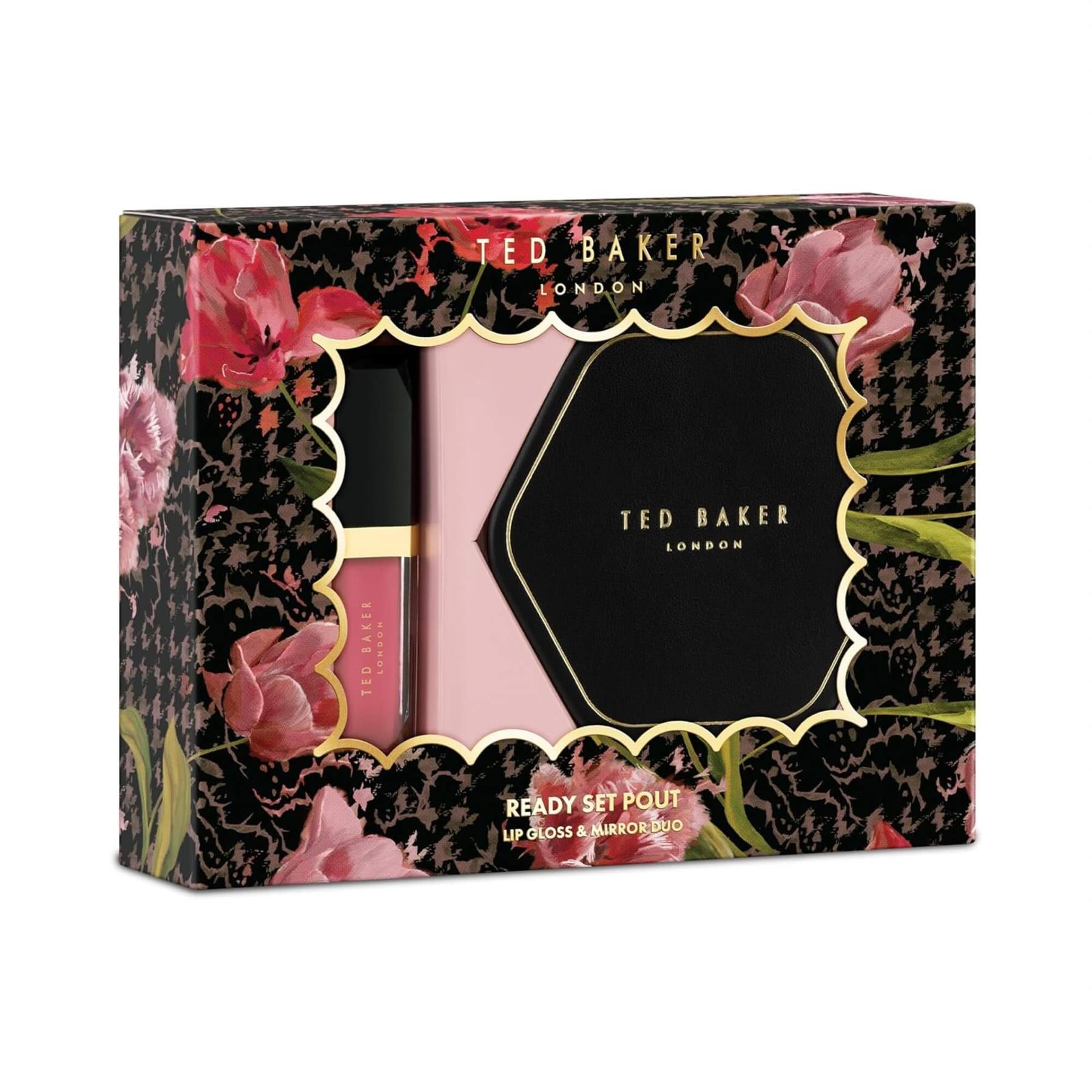 Angled view of Ted Baker Ready Set Pout lip gloss and mirror duo in a black and pink floral gift box